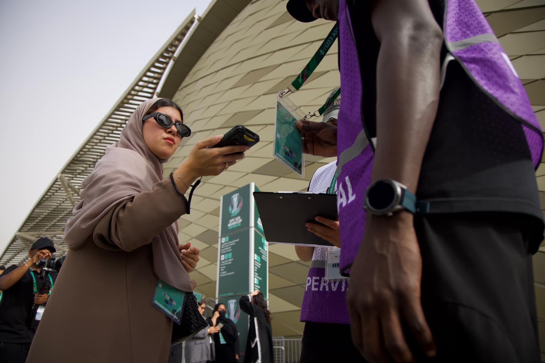 Accreditation scanned at the stadium gates, marshals and supervisors working the queue