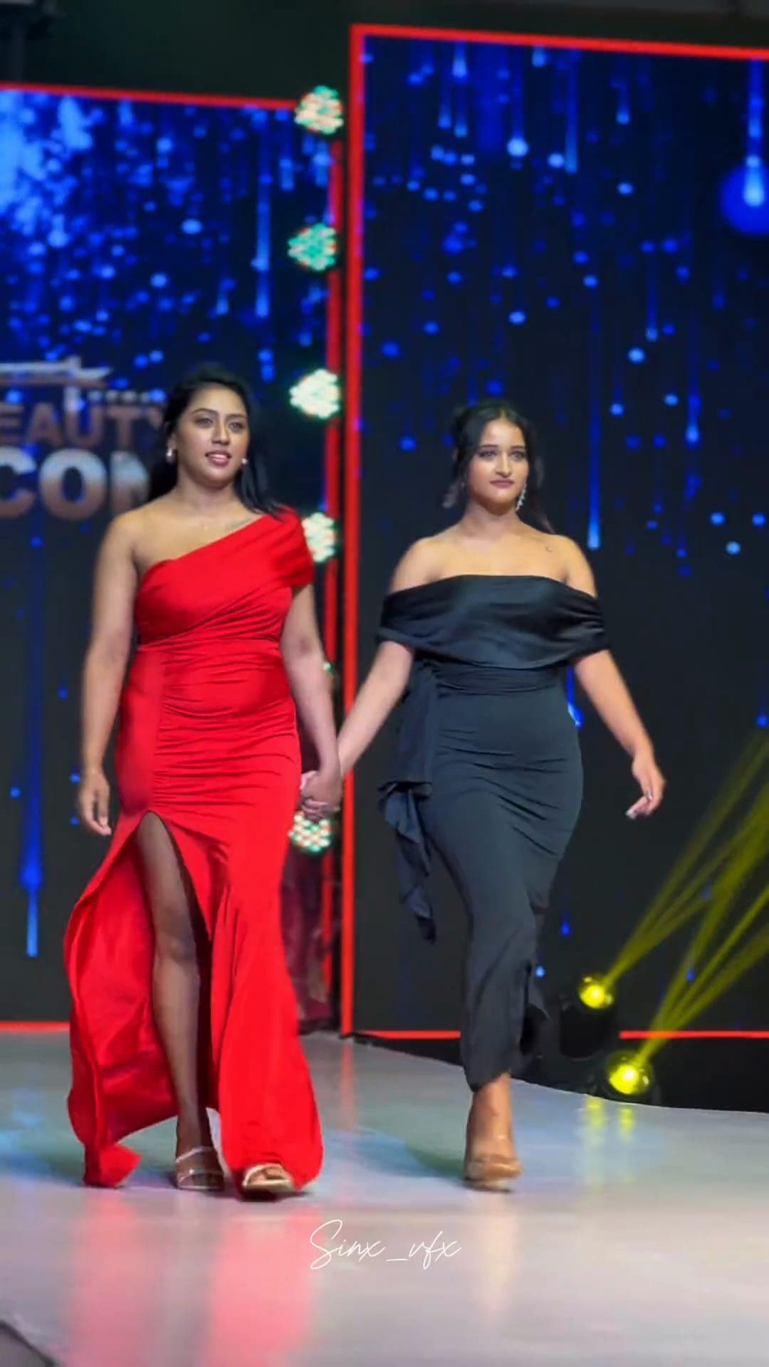 Contestants on a lit pageant runway